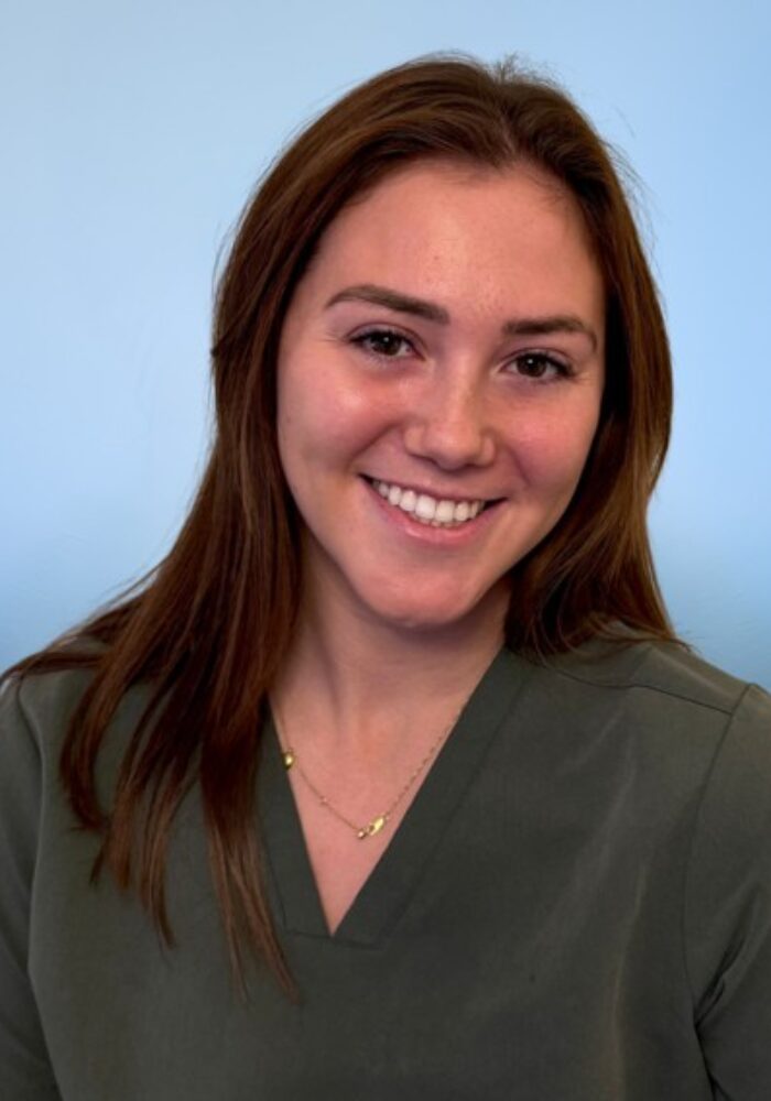 Smiling Woman with White Teeth and Red Curly Hair